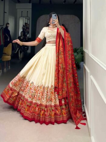 Elegant cream & red lehenga choli with printed dupatta. Perfect designer ethnic wear for weddings, Navratri & festive occasions. Shop lehengas online today.